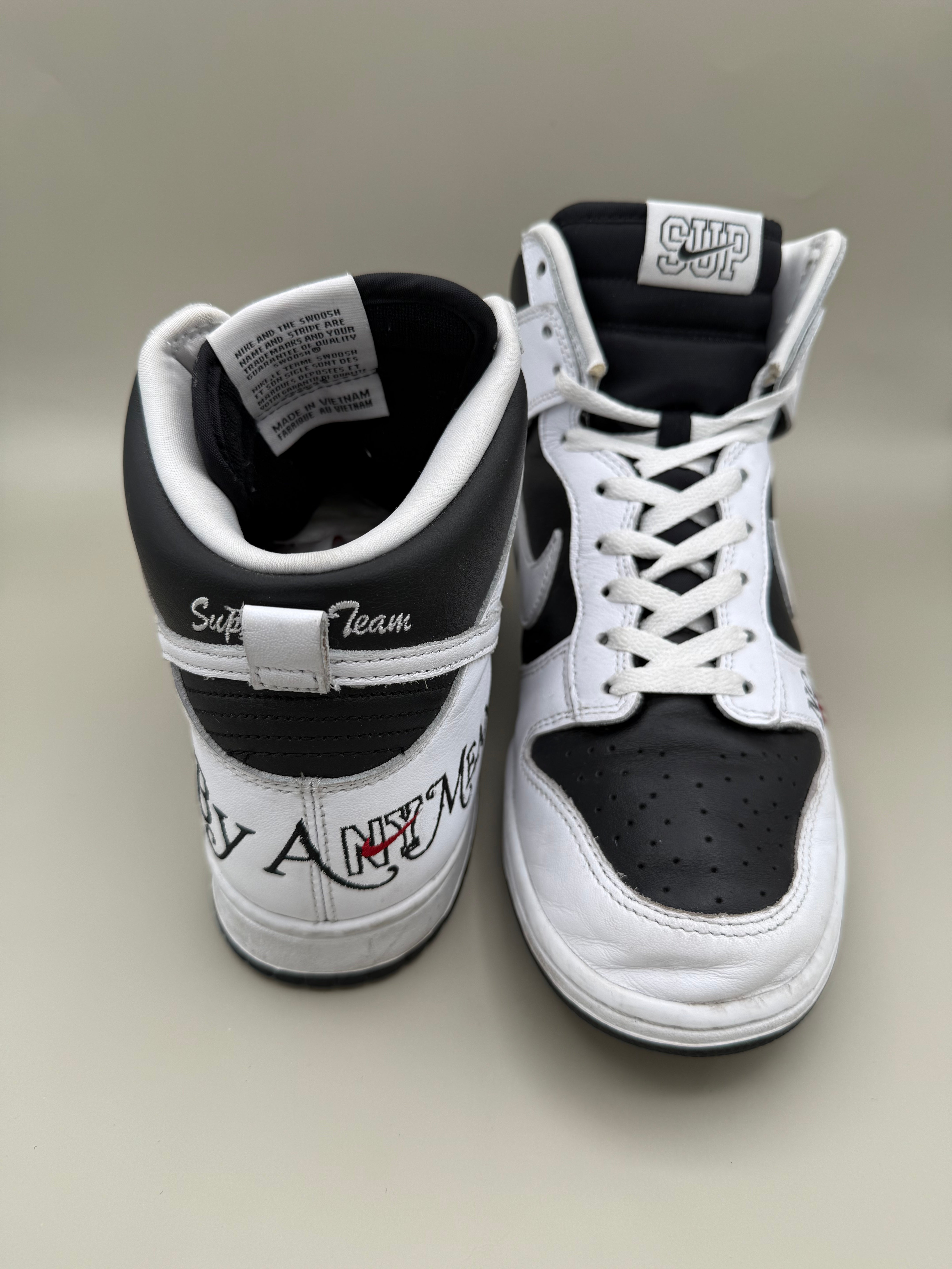 Nike Dunk High, designed in collaboration with or styled after Supreme's "By Any Means" theme.