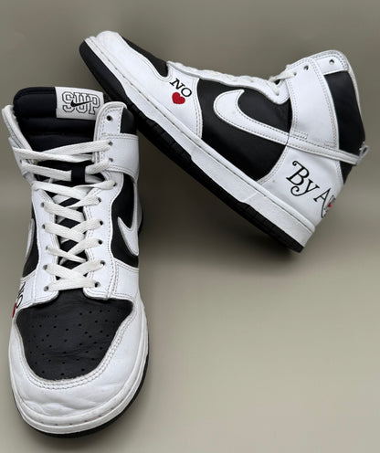 Nike Dunk High, designed in collaboration with or styled after Supreme's "By Any Means" theme.